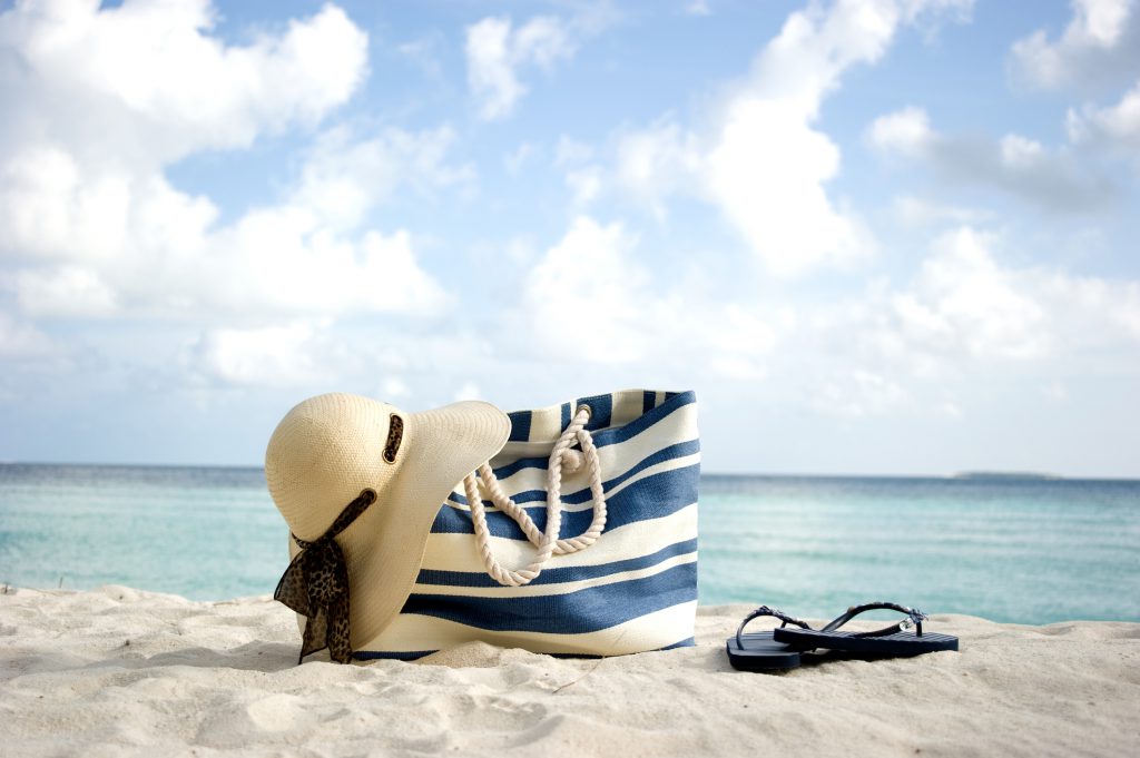 beach bag on the beach with sky and sea in the background