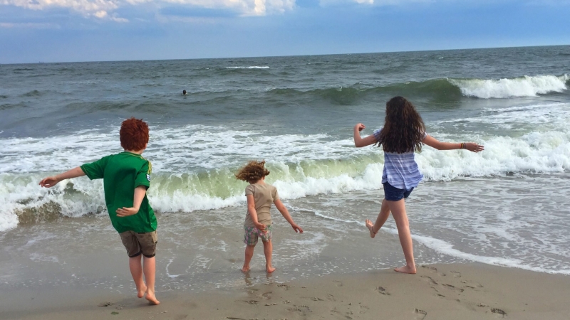 Kids playing in surf